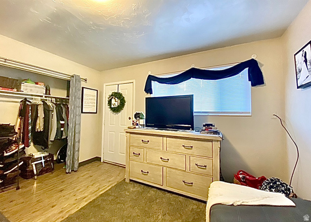 620 East 600 North Logan, UT 84321 - Photo 13 of 13 Bedroom with a closet and dark wood-style flooring