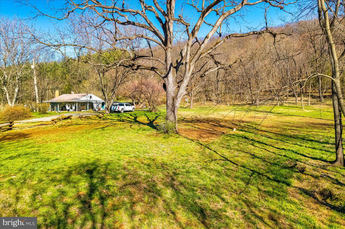 19133 Geeting Road Keedysville, MD 21756 - Photo 10 of 32 a view of a swimming pool with an outdoor space and seating area