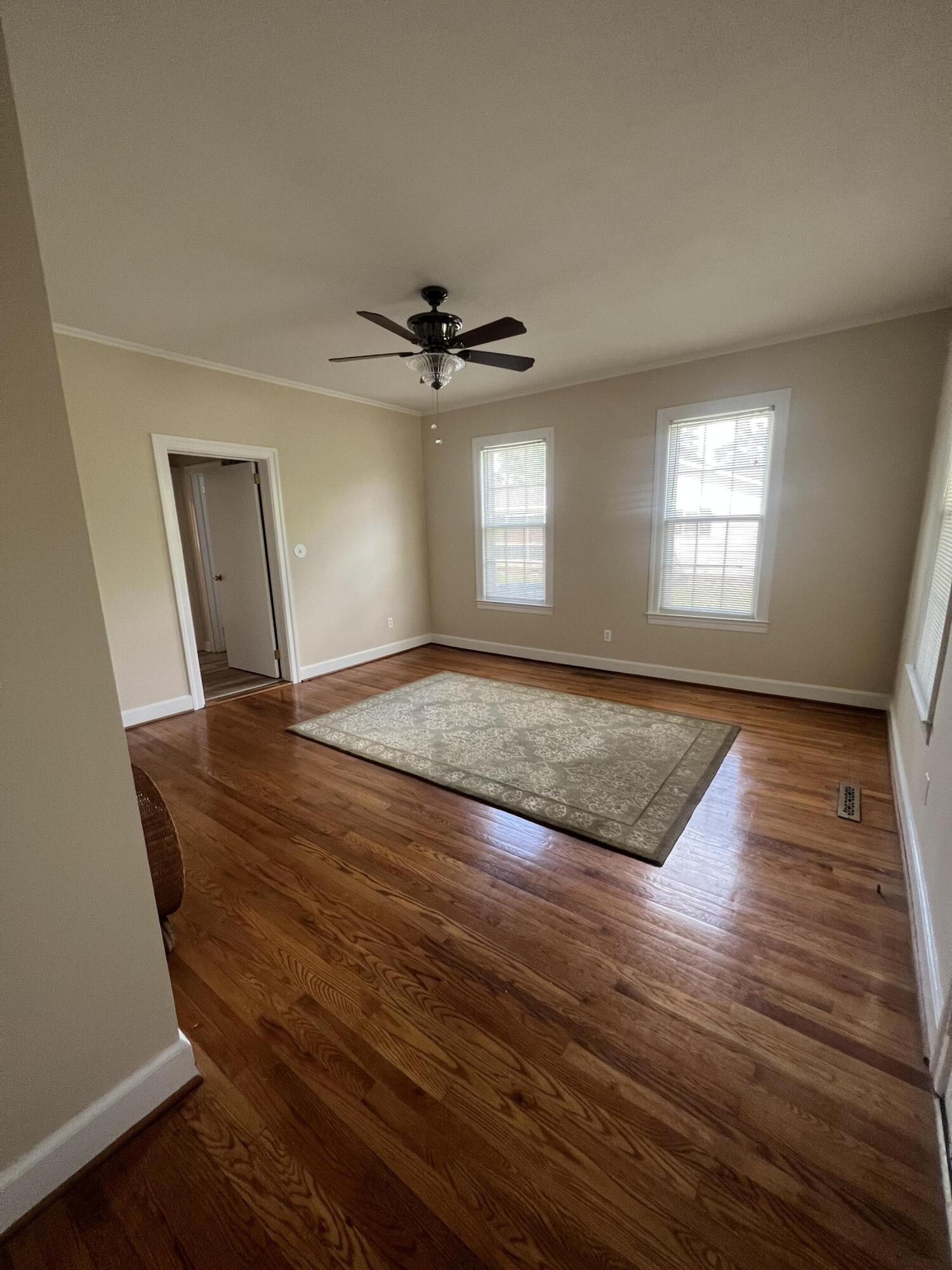 611 Aiken Street Springfield, SC 29146 - Photo 10 of 22 a view of empty room with wooden floor and fan