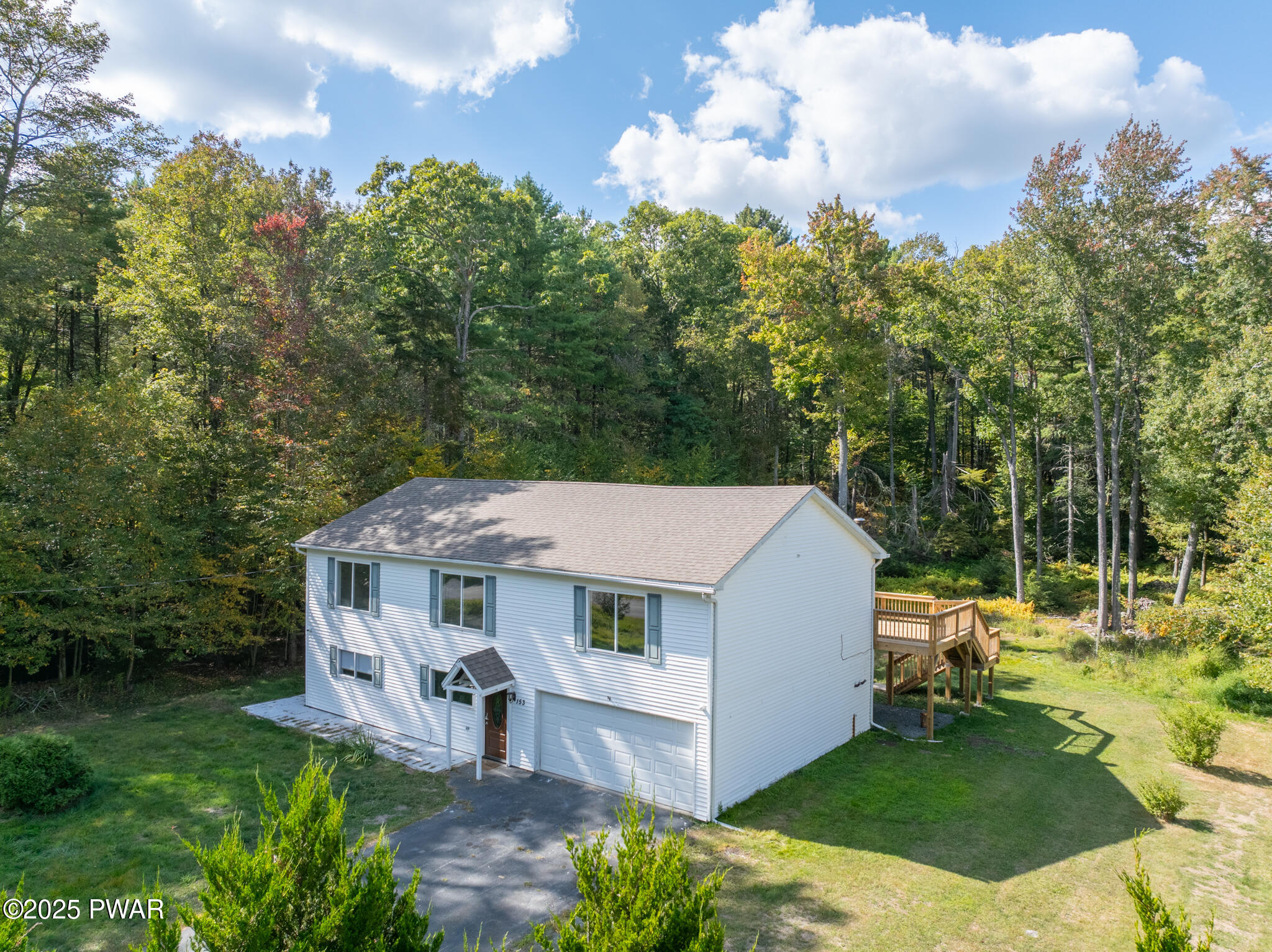 153 Hatton Road Hawley, PA 18428 - Photo 1 of 38 an aerial view of a house with a big yard