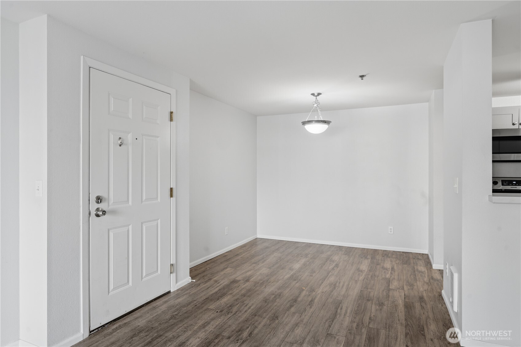 975 Aberdeen Avenue Northeast, Unit F308 Renton, WA 98056 - Photo 11 of 20 a view of an empty room with wooden floor