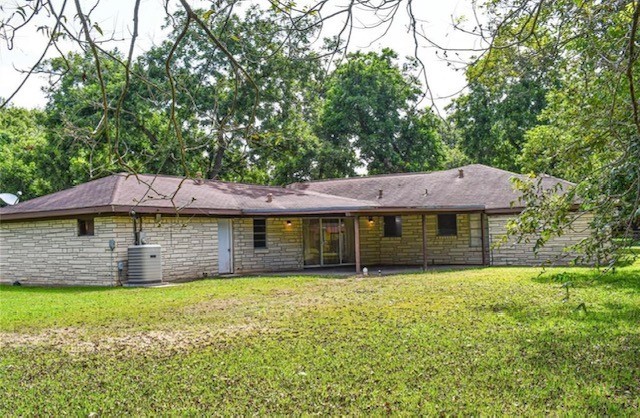 409 Koehl Street Wharton, TX 77488 - Photo 16 of 17 a front view of a house with yard