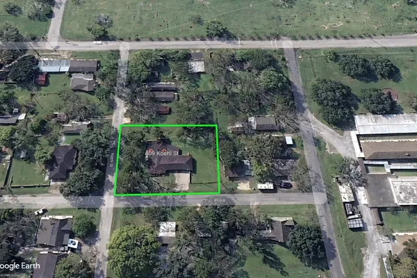 an aerial view of houses with outdoor space