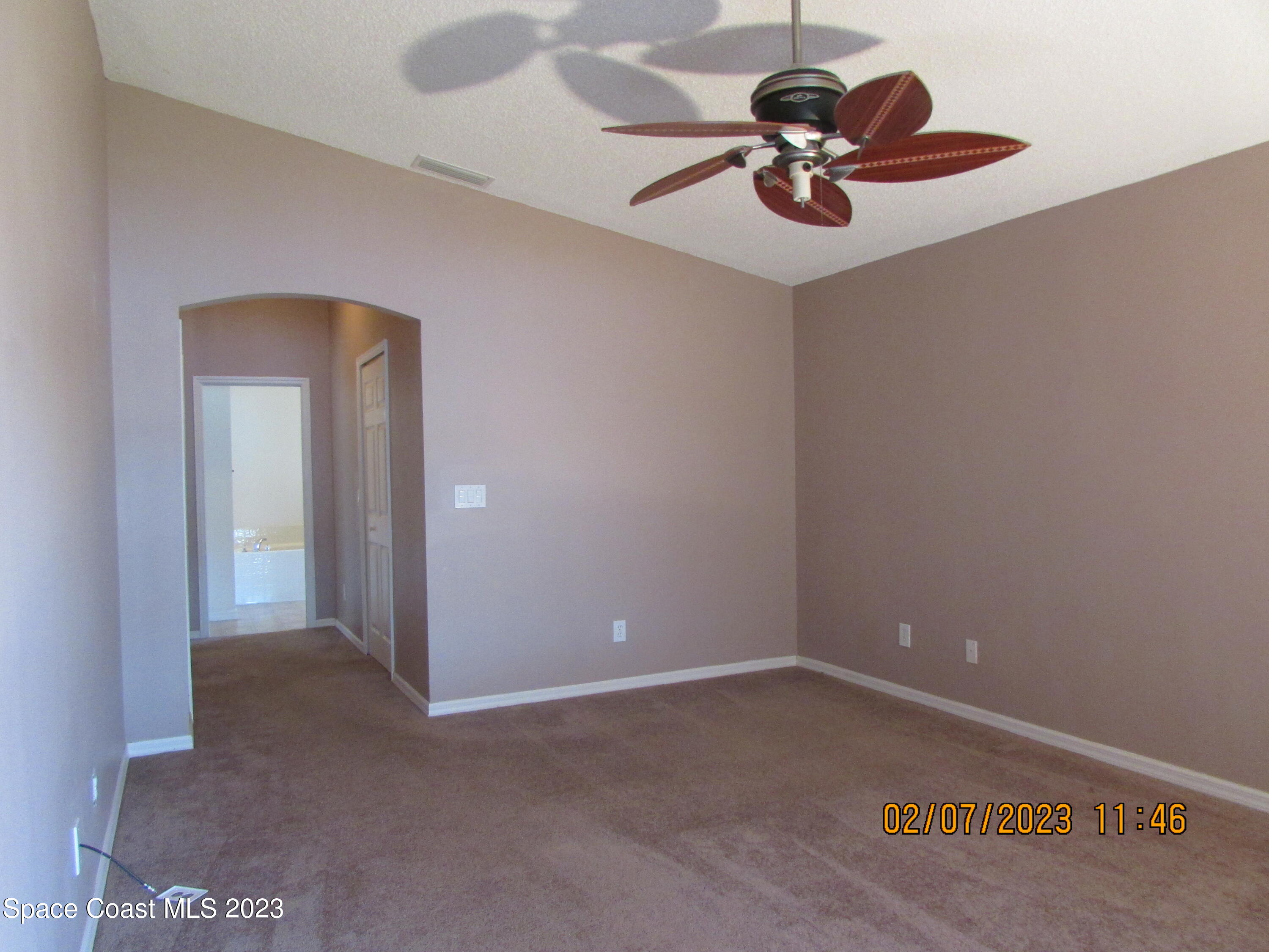 4001 Wilkes Drive Melbourne, FL 32901 - Photo 13 of 21 a view of an empty room and a ceiling fan