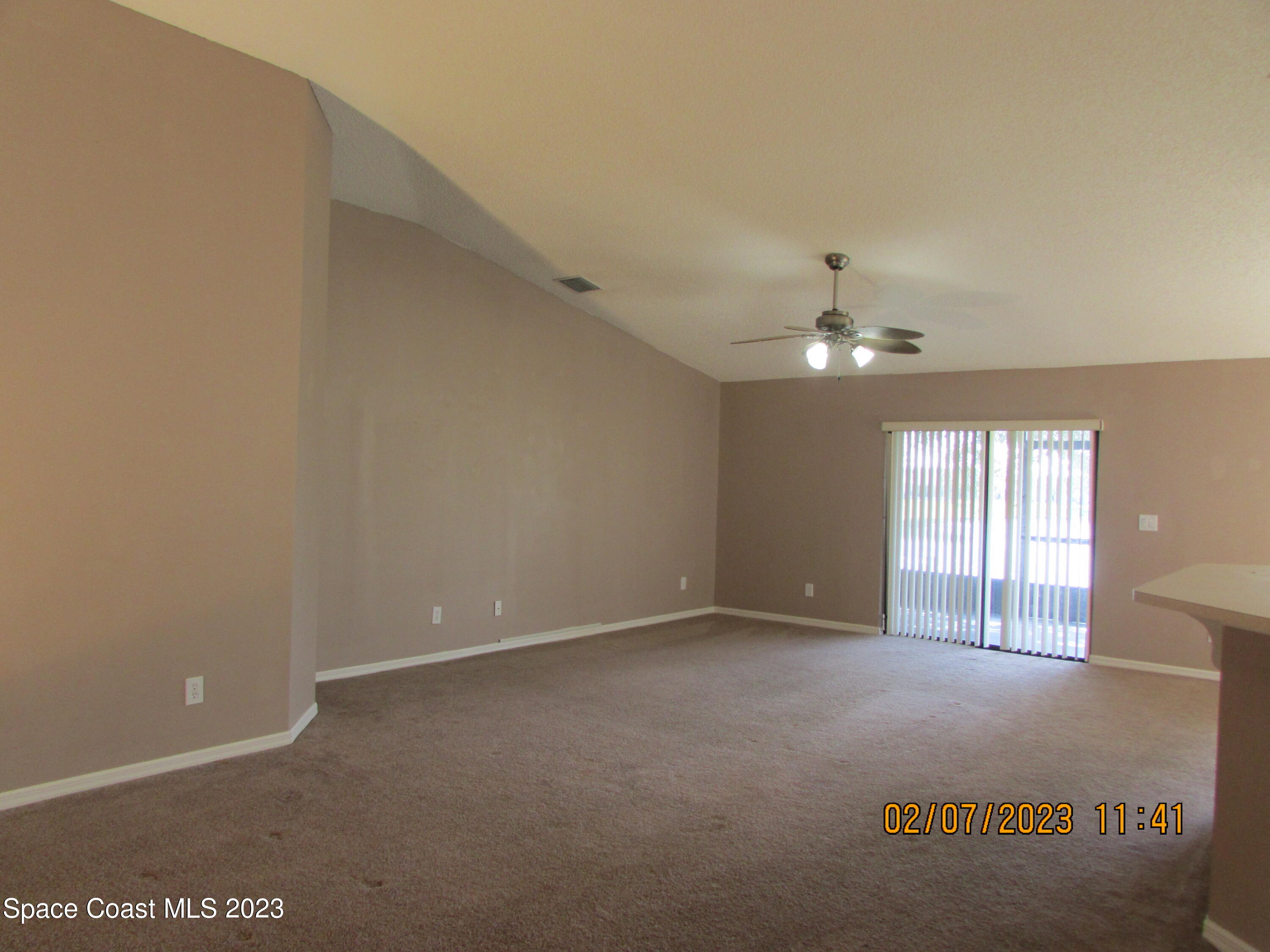 4001 Wilkes Drive Melbourne, FL 32901 - Photo 7 of 21 a view of an empty room with a window