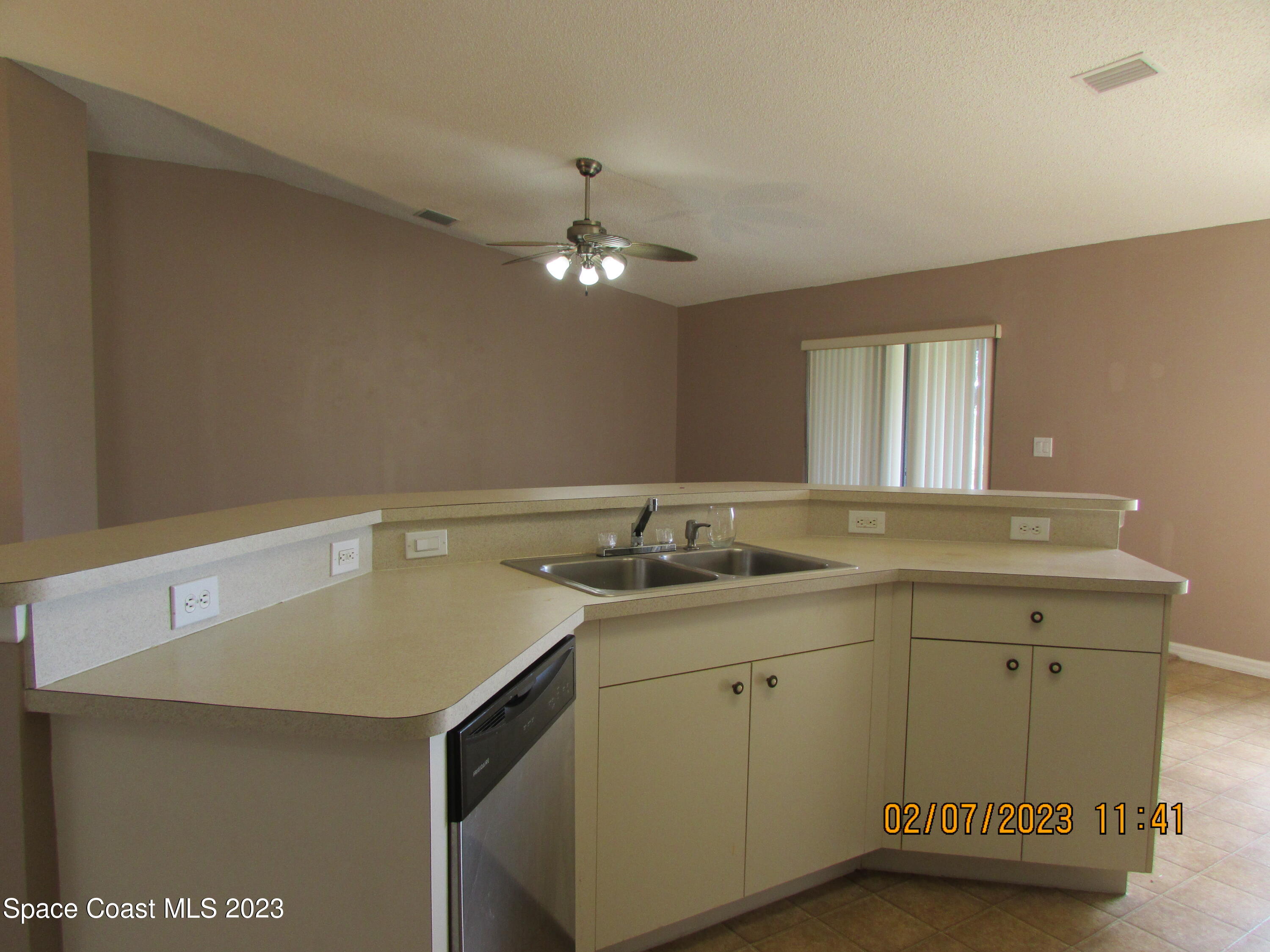 4001 Wilkes Drive Melbourne, FL 32901 - Photo 9 of 21 a bathroom with a sink a vanity and a mirror