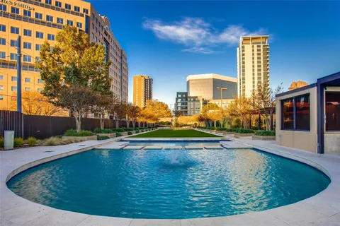 a view of swimming pool with outdoor seating