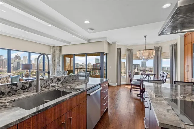 a large kitchen with a large window and furniture