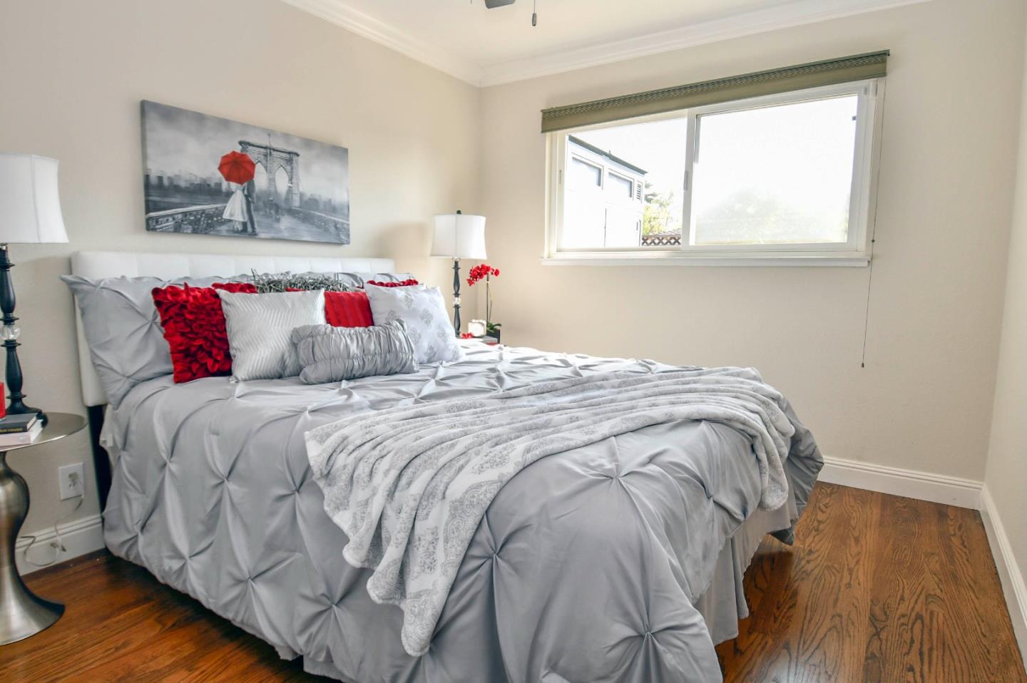 3956 Vía Salice Campbell, CA 95008 - Photo 12 of 21 a bedroom with a bed and a painting on the wall