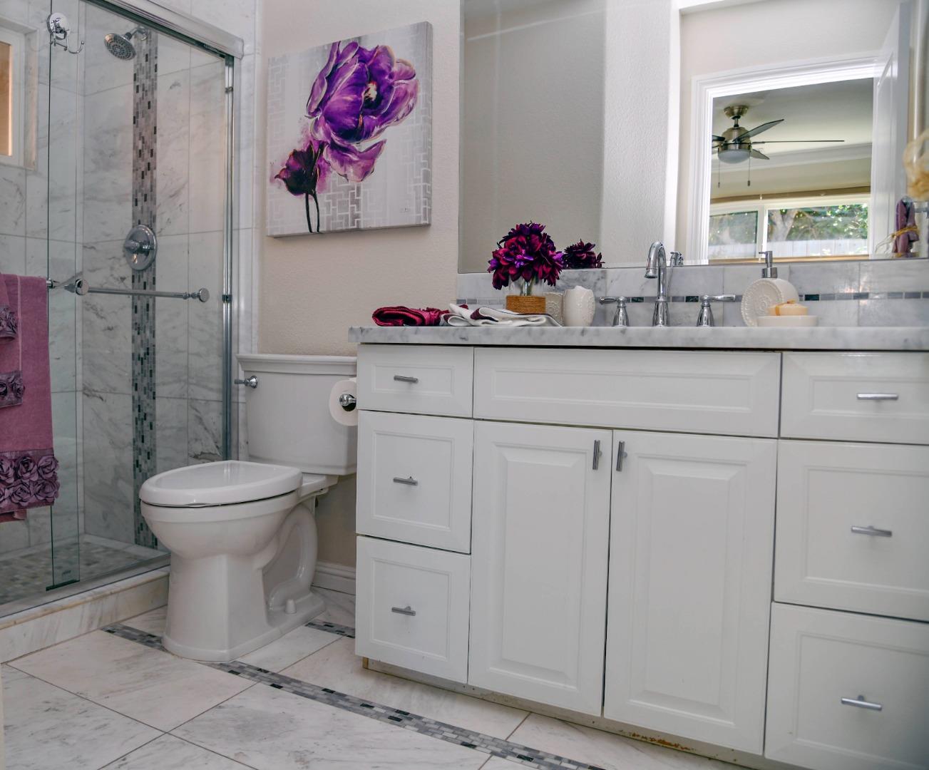3956 Vía Salice Campbell, CA 95008 - Photo 17 of 21 a bathroom with a toilet sink and mirror