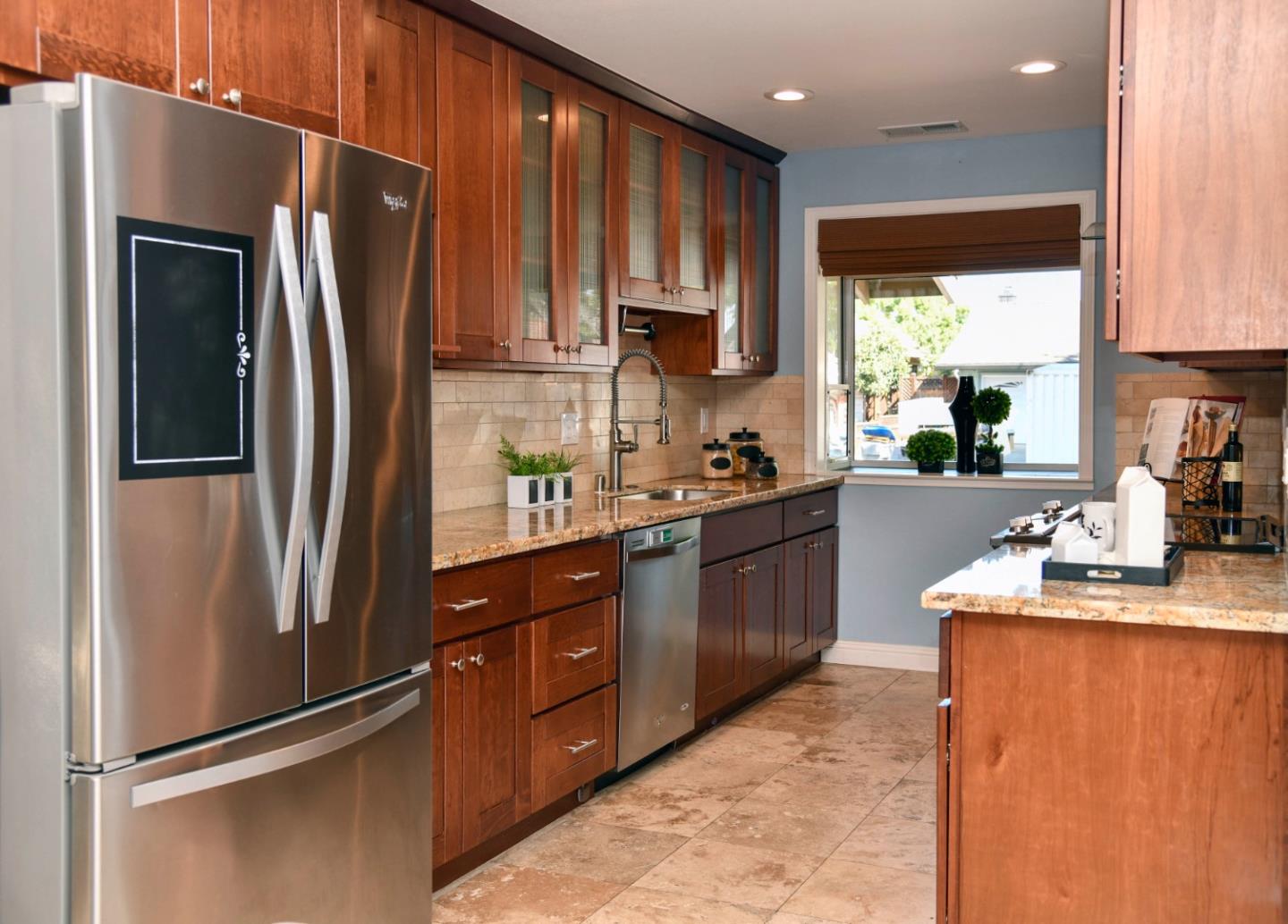 3956 Vía Salice Campbell, CA 95008 - Photo 7 of 21 a kitchen with stainless steel appliances granite countertop a refrigerator a sink a stove and a refrigerator