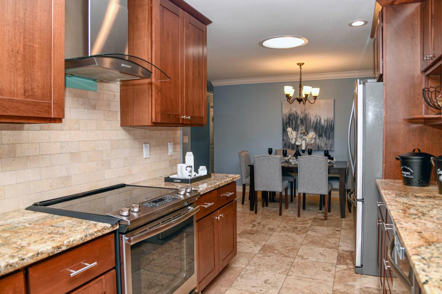 3956 Vía Salice Campbell, CA 95008 - Photo 9 of 21 a kitchen with stainless steel appliances granite countertop a stove a sink and a refrigerator