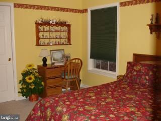 209 Windjammer Road Ocean Pines, MD 21811 - Photo 4 of 4 a balcony with table and chairs