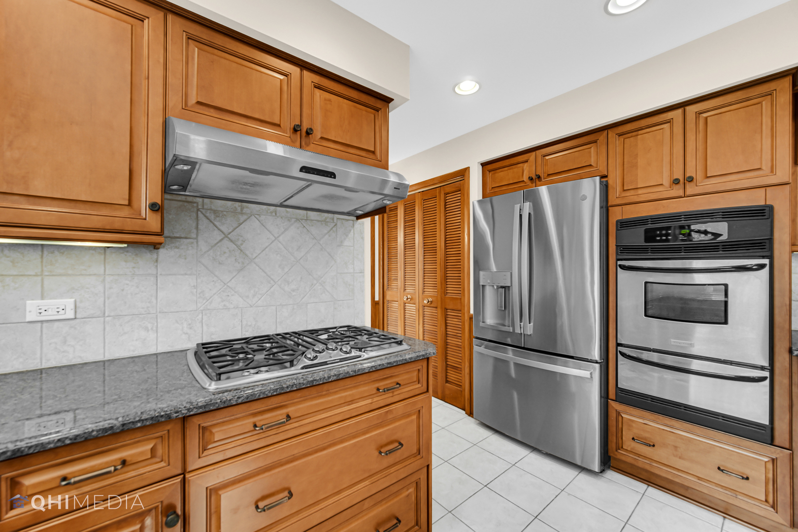 123 South Ridge Avenue Arlington Heights, IL 60005 - Photo 24 of 37 a kitchen with stainless steel appliances granite countertop a refrigerator and cabinets