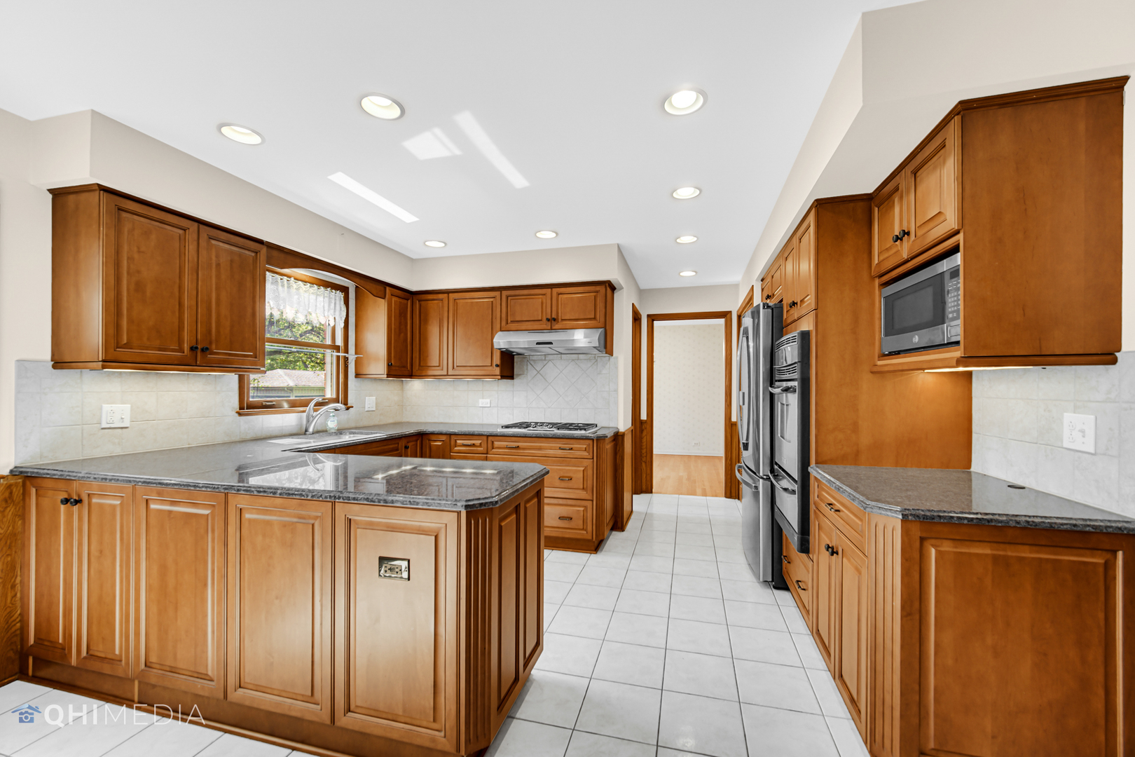 123 South Ridge Avenue Arlington Heights, IL 60005 - Photo 25 of 37 a kitchen with stainless steel appliances granite countertop wooden cabinets a sink and dishwasher