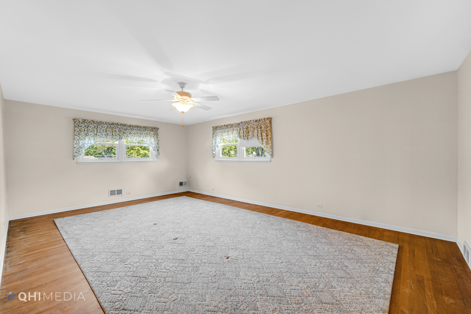 123 South Ridge Avenue Arlington Heights, IL 60005 - Photo 5 of 37 wooden floor in an empty room with a window