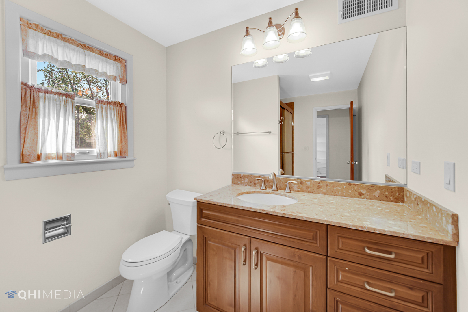 123 South Ridge Avenue Arlington Heights, IL 60005 - Photo 6 of 37 a bathroom with a granite countertop sink vanity mirror and toilet