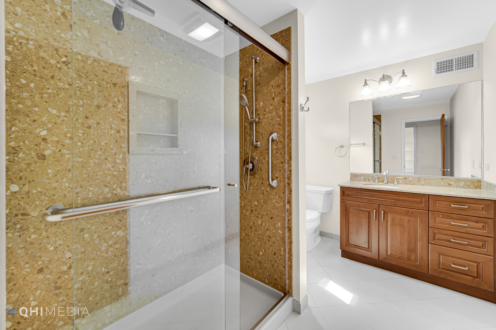 123 South Ridge Avenue Arlington Heights, IL 60005 - Photo 7 of 37 a bathroom with a glass shower door and a sink