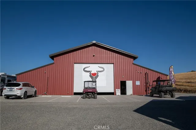 a view of a kitchen with a dining table and chairs
