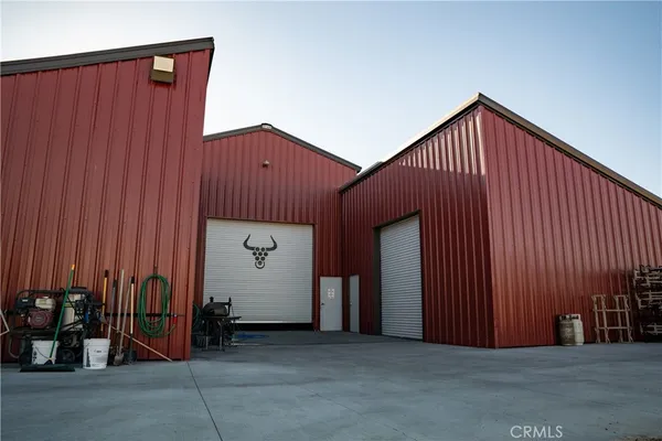 a room with lots of wooden furniture and windows