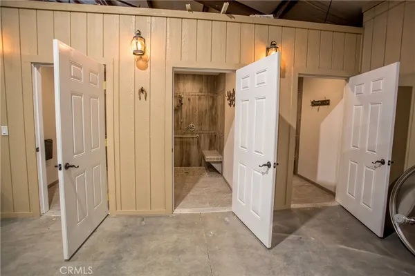 a room with gym equipment and a mirror