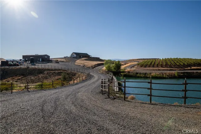 a view of a chairs and table in the patio