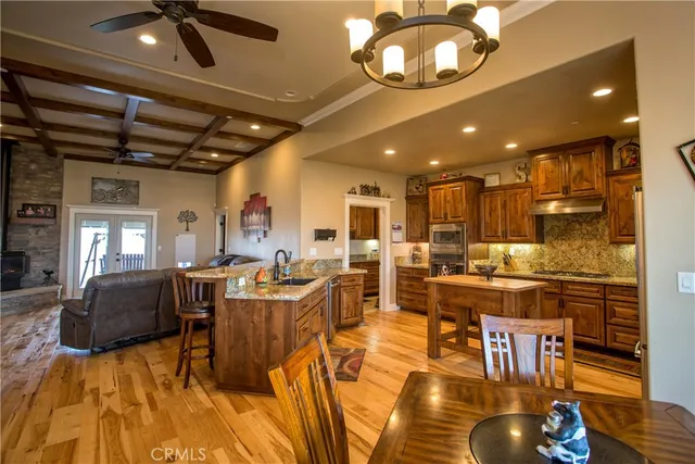 a view of a dining room with furniture and chandelier