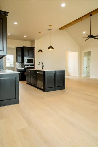 an empty room with windows and entrance