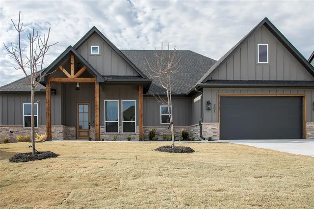a front view of a house with parking space