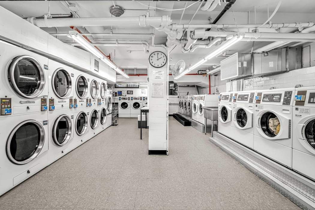 11 Riverside Drive, Unit 5PW Manhattan, NY 10023 - Photo 8 of 10 a utility room with dryer and washer