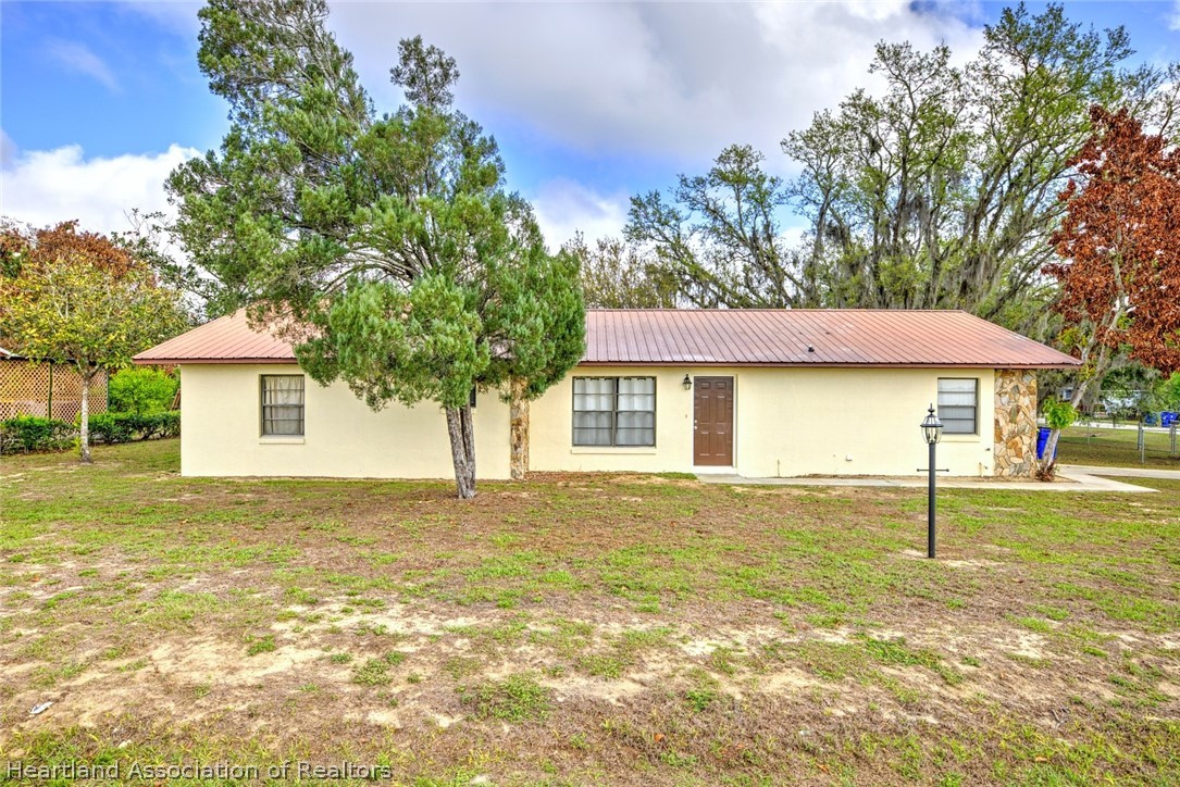 2052 West Stryker Road Avon Park, FL 33825 - Photo 1 of 45 a view of a house with a swimming pool