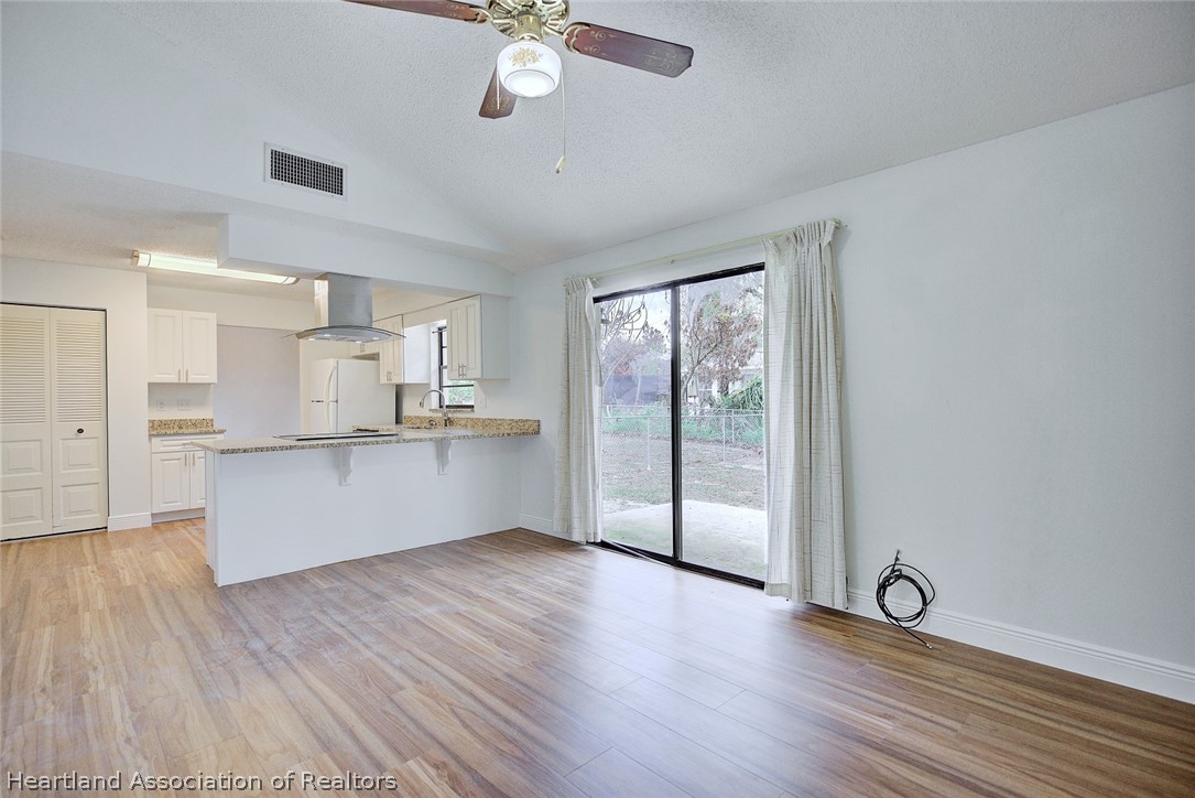 2052 West Stryker Road Avon Park, FL 33825 - Photo 20 of 45 a view of an empty room with wooden floor and a window