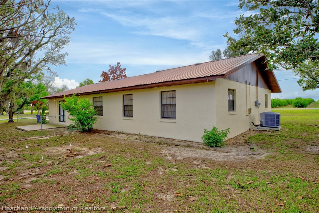 2052 West Stryker Road Avon Park, FL 33825 - Photo 39 of 45 a view of a house with a yard
