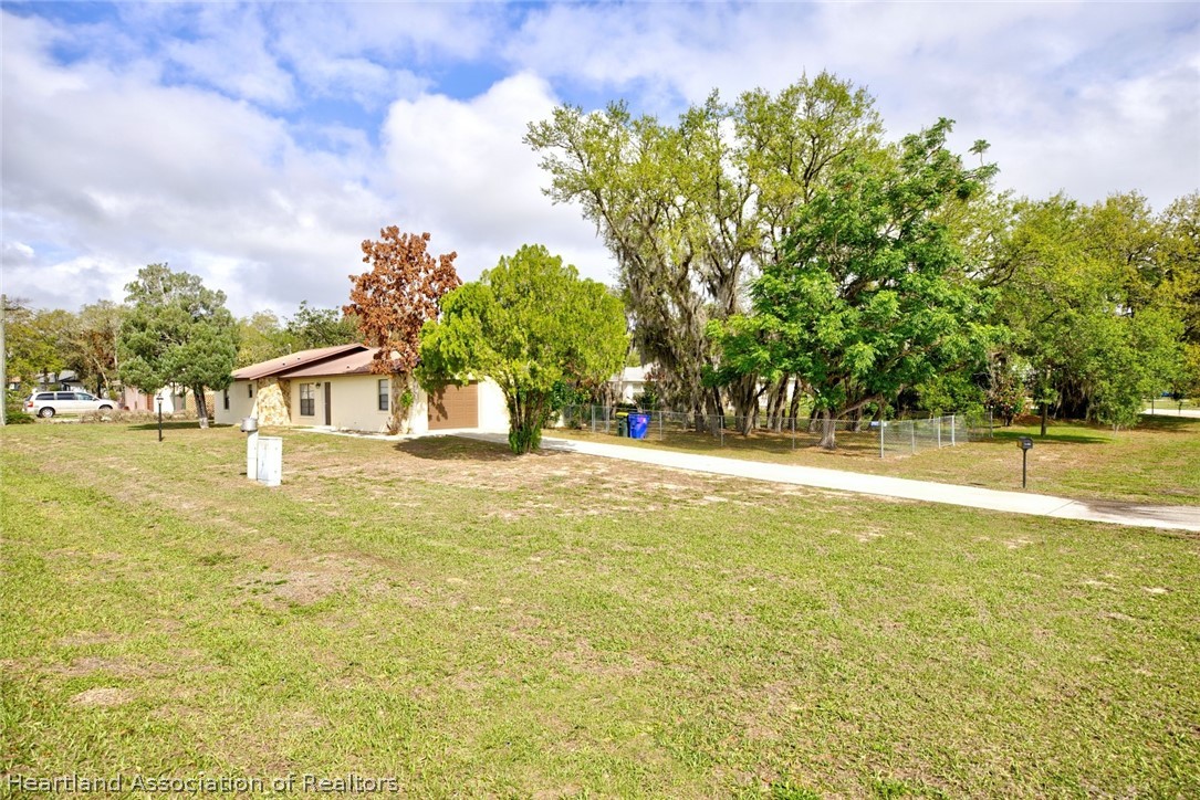 2052 West Stryker Road Avon Park, FL 33825 - Photo 44 of 45 a view of swimming pool with an outdoor seating