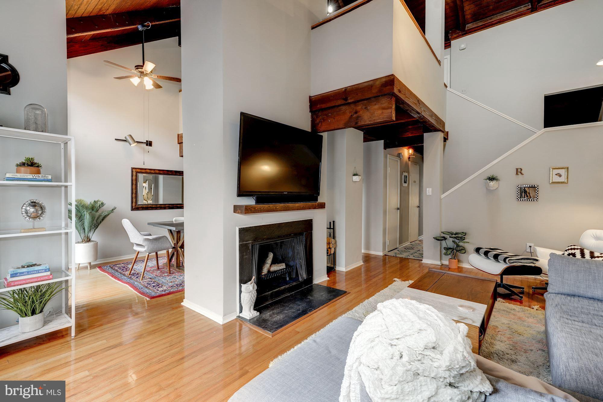 11184 Glade Drive Reston, VA 20191 - Photo 5 of 21 Wood burning fireplace and soaring cielings