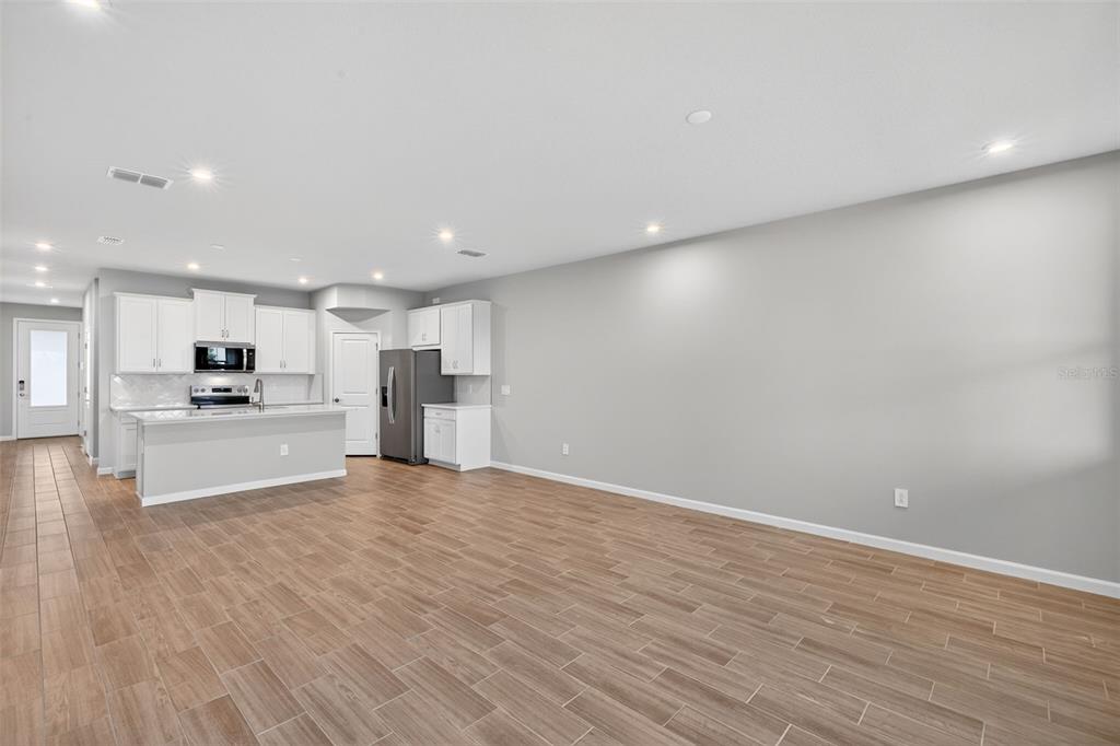 8822 Ginko Run Parrish, FL 34219 - Photo 15 of 30 a view of kitchen with kitchen island and stainless steel appliances