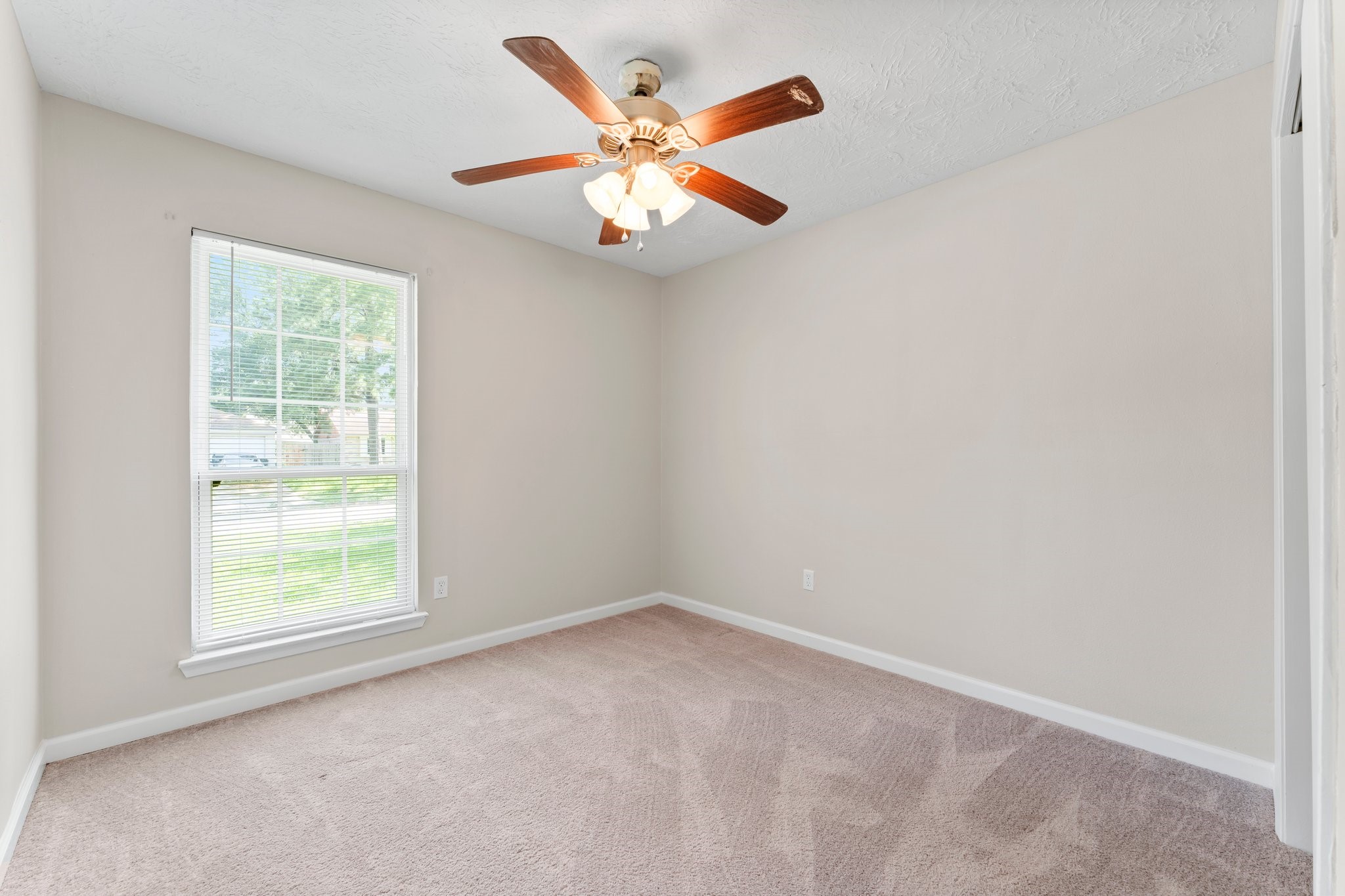 3527 Acorn Way Lane Spring, TX 77389 - Photo 11 of 26 an empty room with a window and a fan