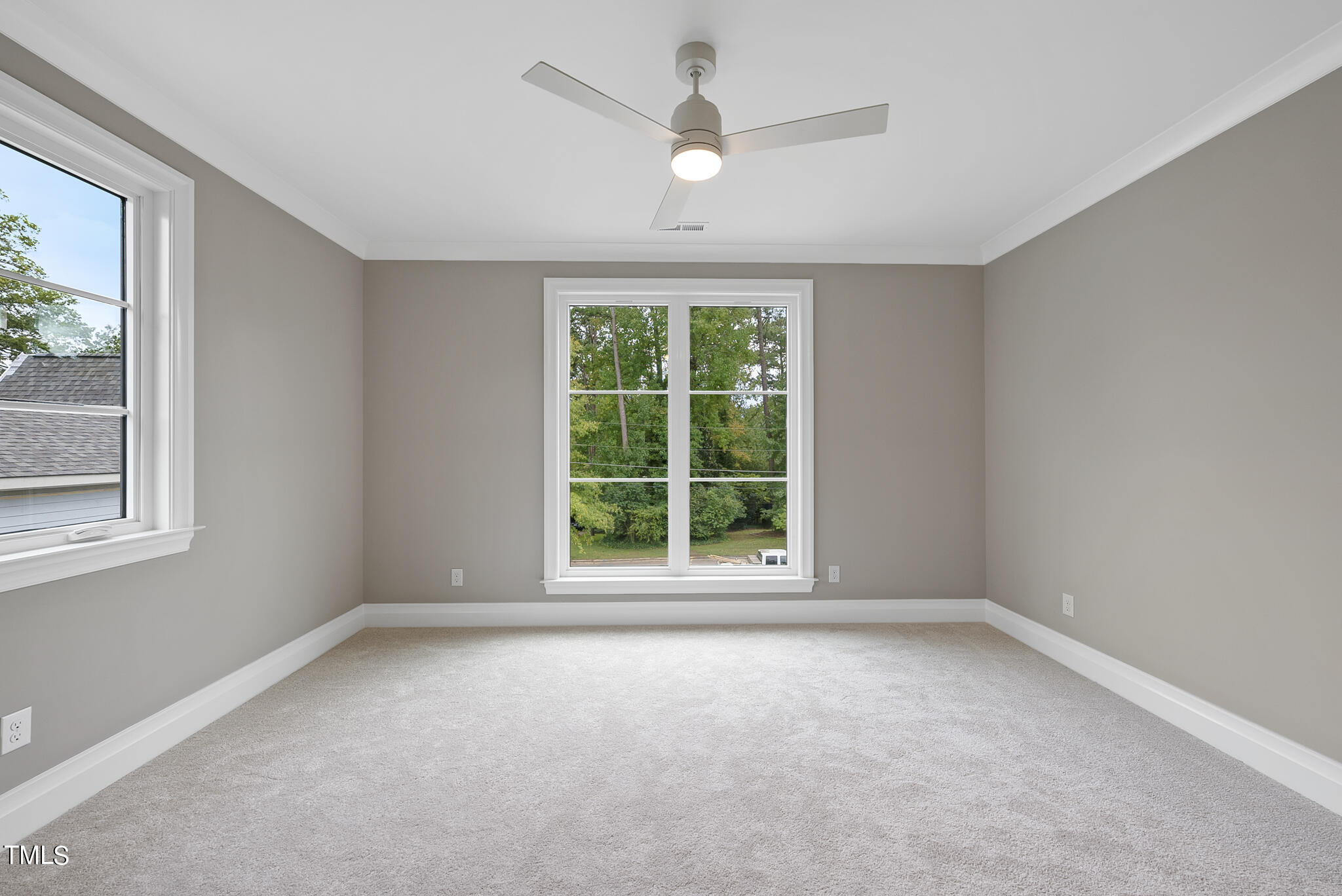 3414 Bradley Place Raleigh, NC 27607 - Photo 20 of 37 an empty room with a window and a ceiling fan
