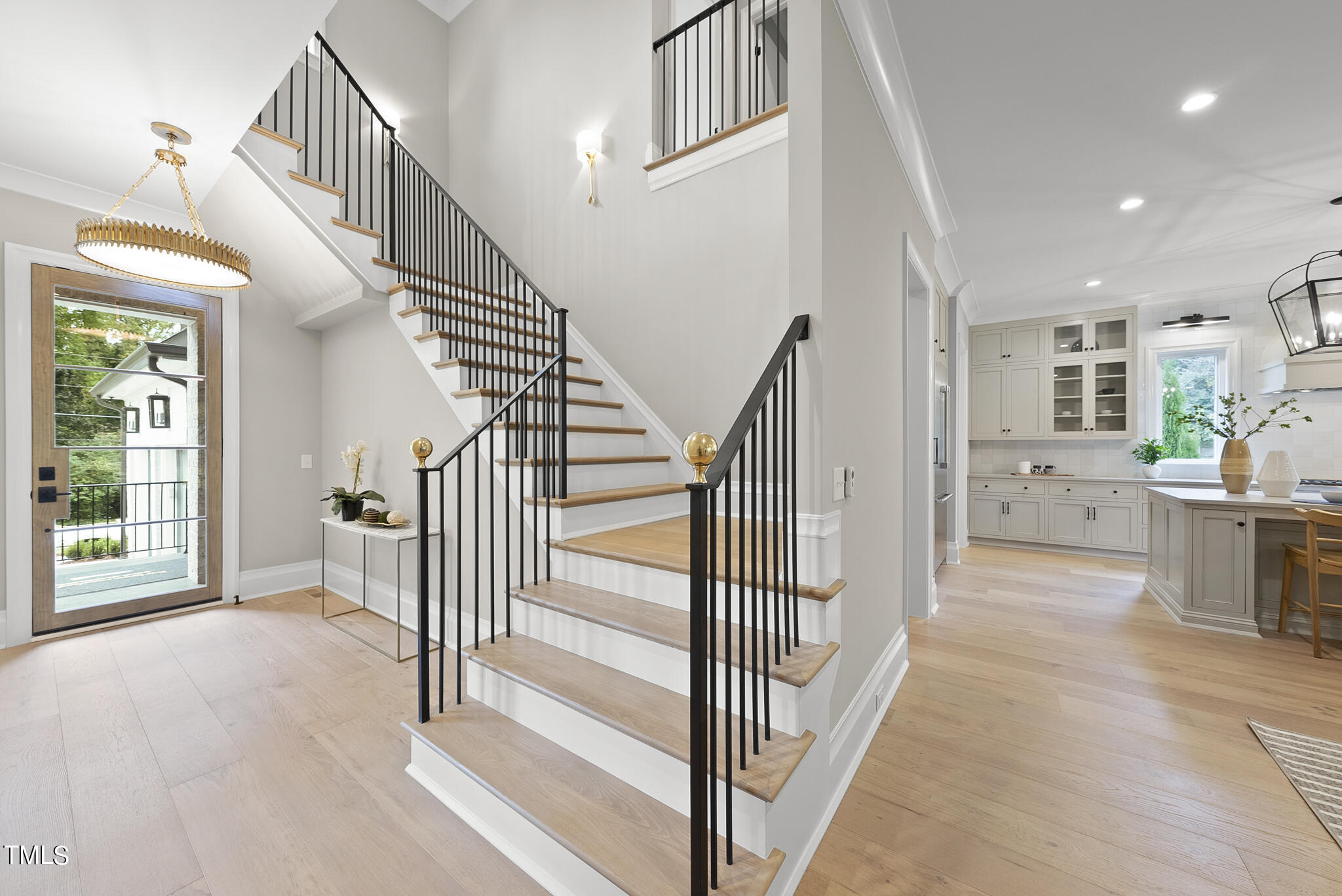 3414 Bradley Place Raleigh, NC 27607 - Photo 3 of 37 a view of a hallway with dining room and stairs