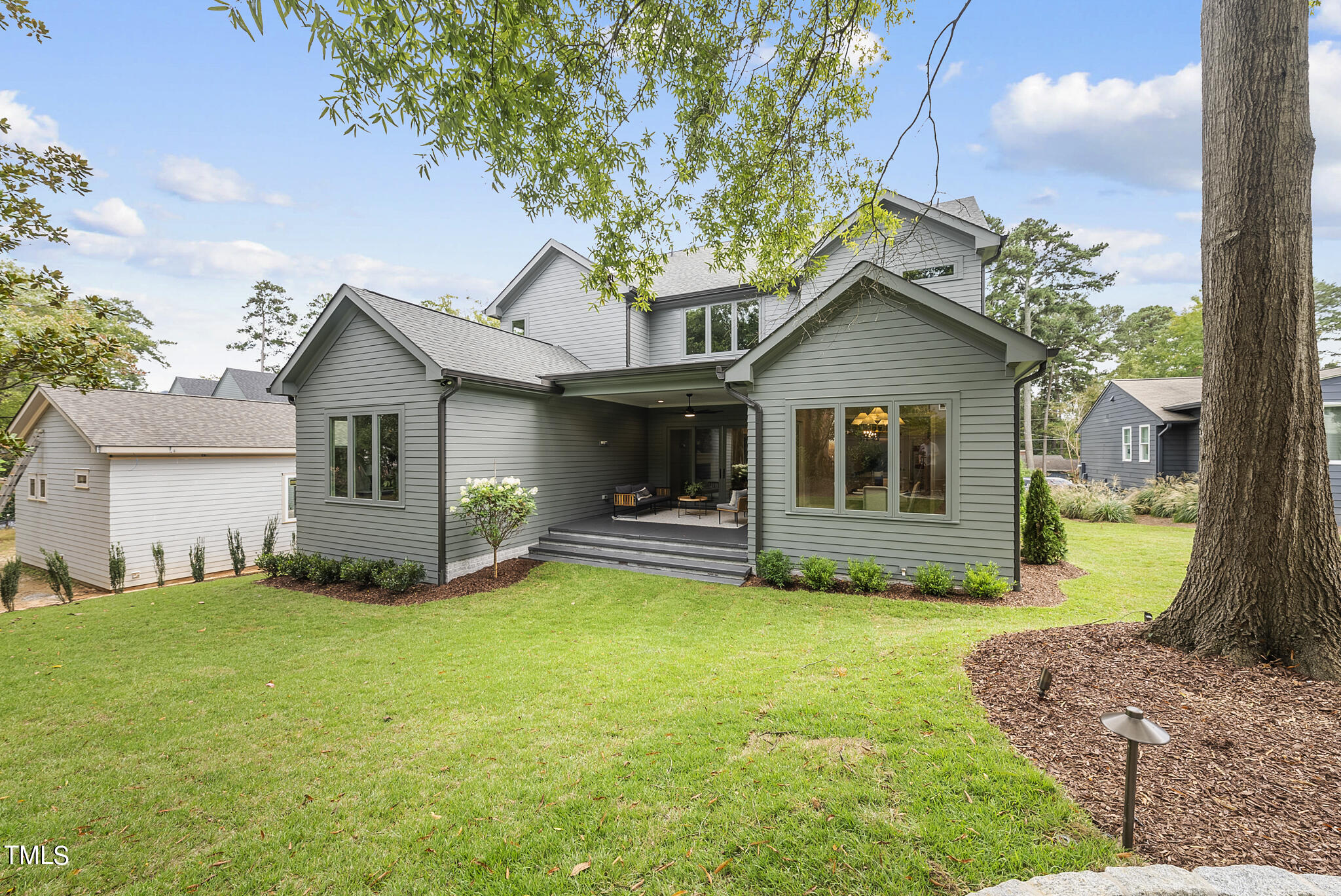 3414 Bradley Place Raleigh, NC 27607 - Photo 36 of 37 a view of a house with a yard and sitting area