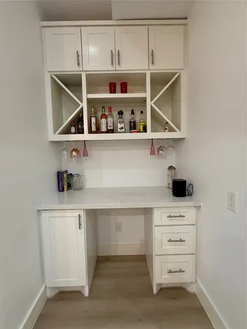 a kitchen with a cabinets and window