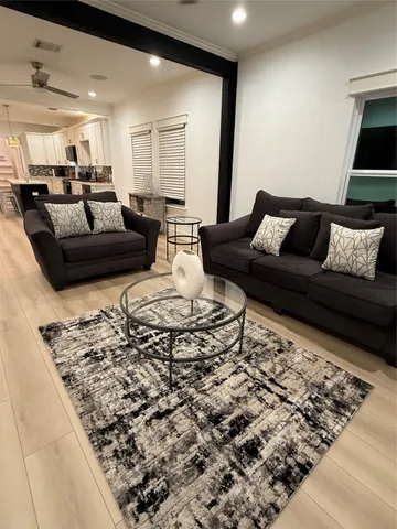a living room with furniture and a rug