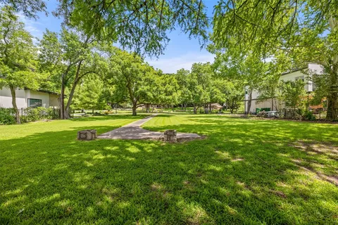 a view of a park with large trees