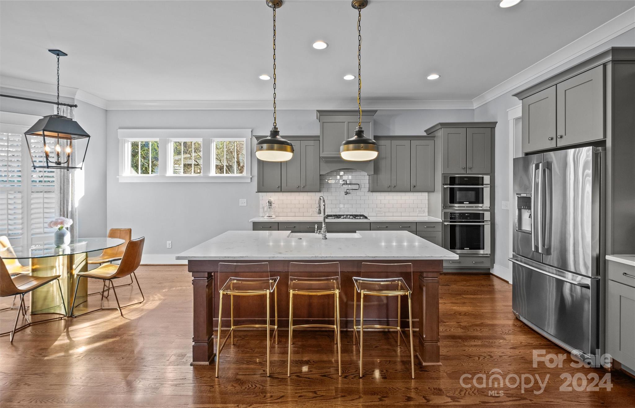 149 McAlway Road Charlotte, NC 28211 - Photo 11 of 48 a kitchen with kitchen island a stove and a refrigerator