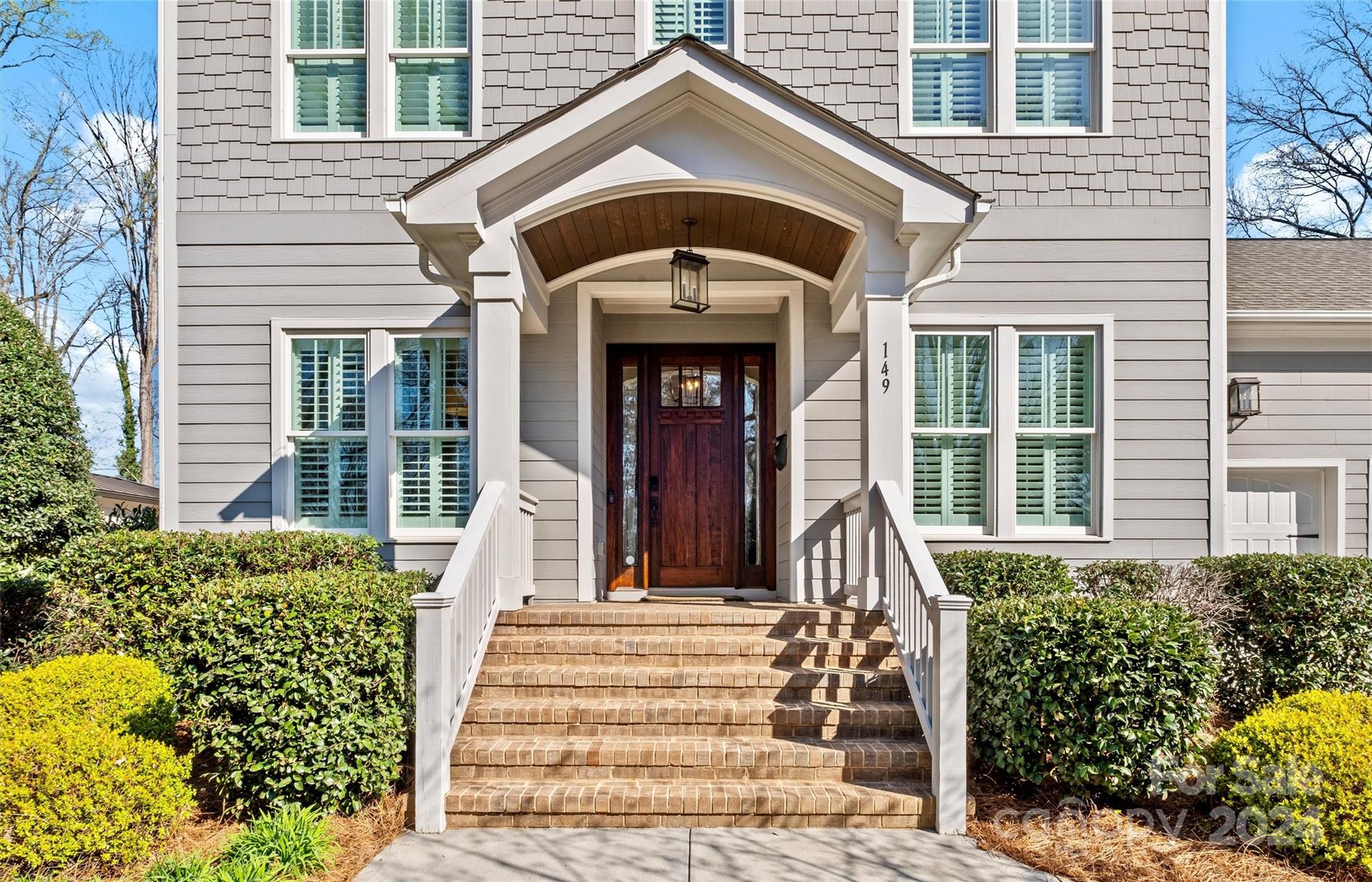 149 McAlway Road Charlotte, NC 28211 - Photo 2 of 48 a front view of a house with a garden