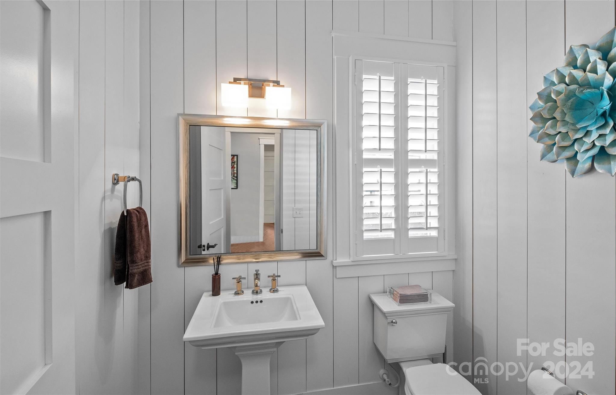 149 McAlway Road Charlotte, NC 28211 - Photo 22 of 48 a bathroom with a toilet sink and mirror