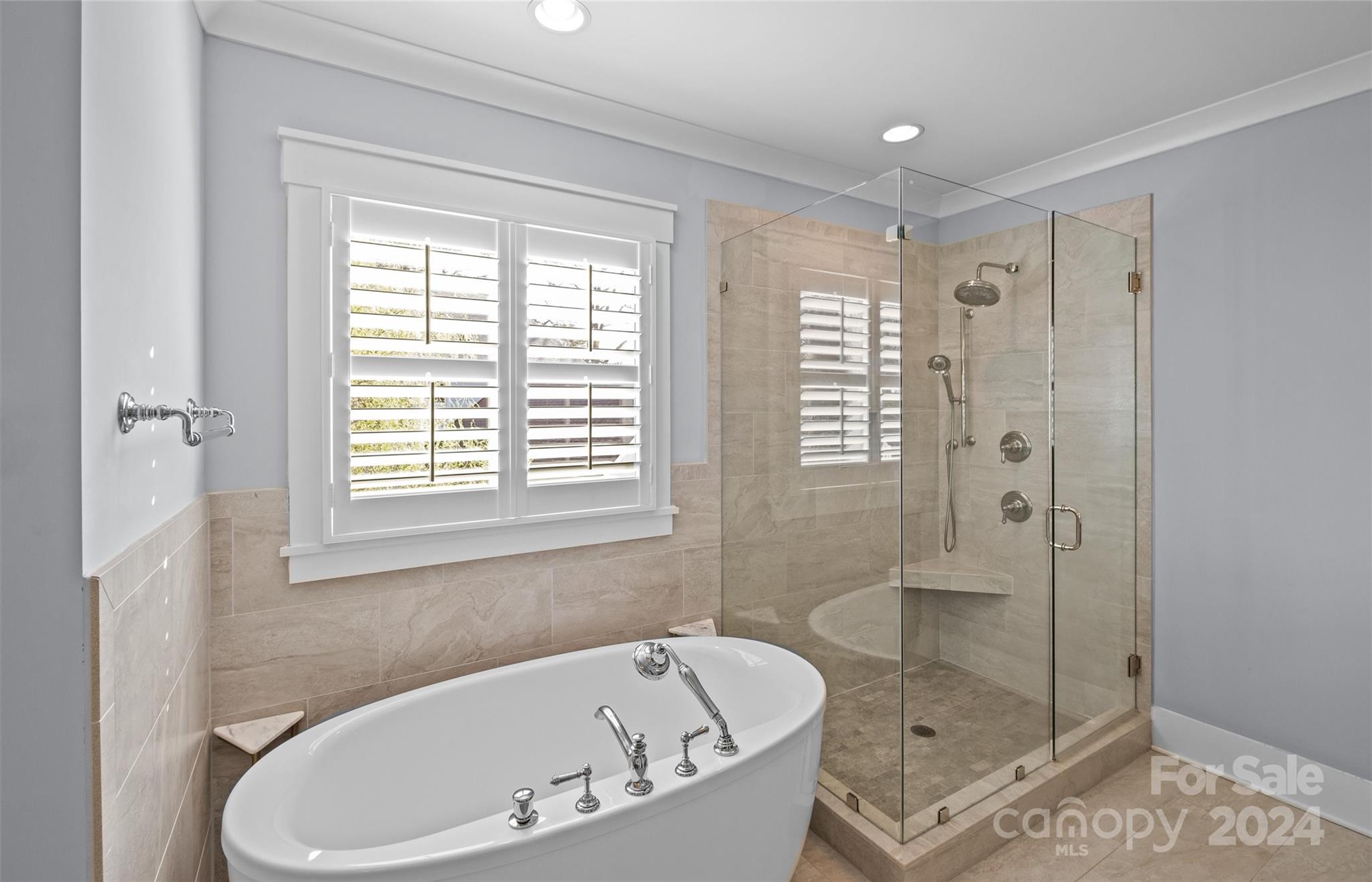 149 McAlway Road Charlotte, NC 28211 - Photo 27 of 48 a white bath tub sitting next to a shower