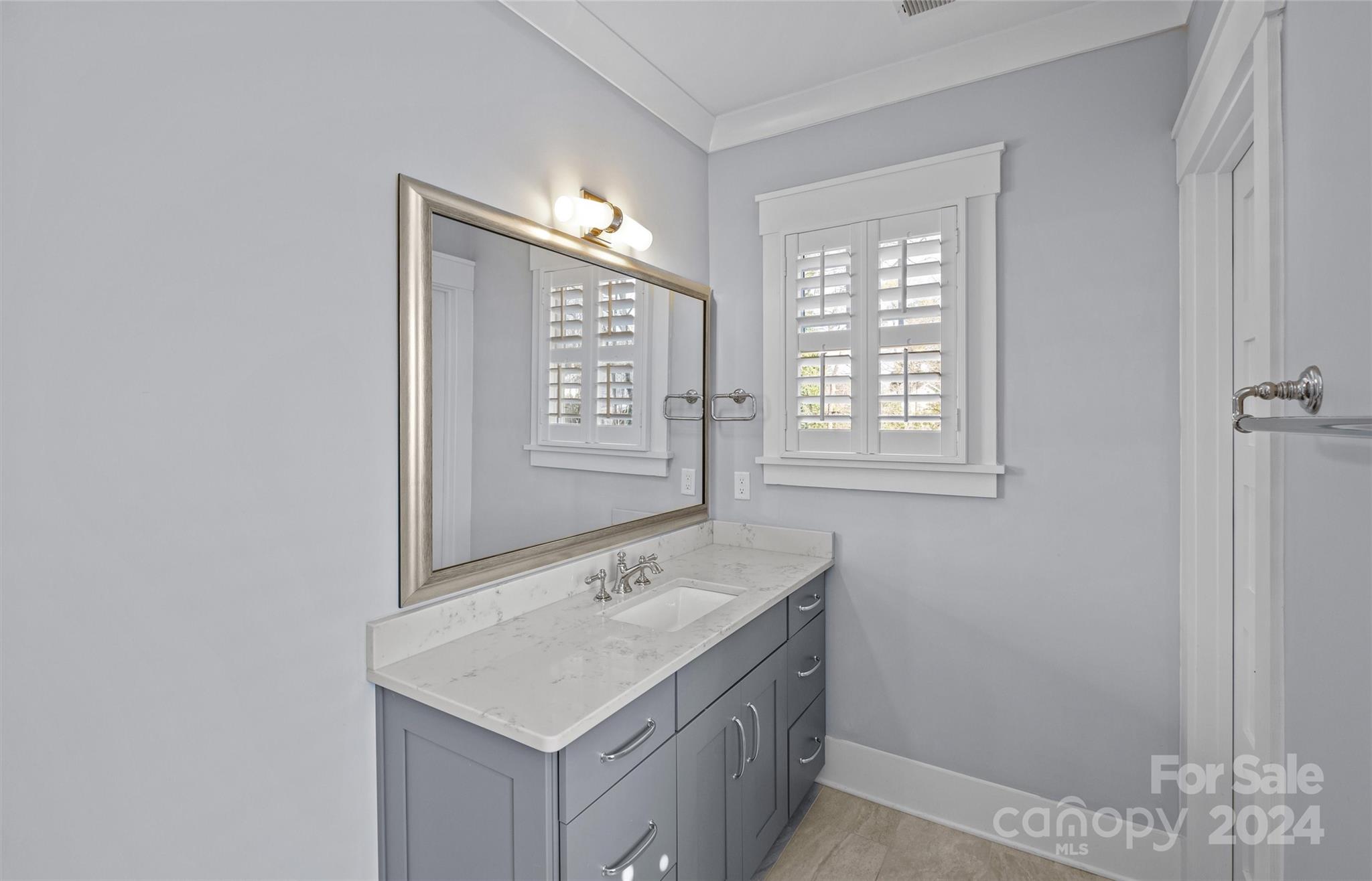 149 McAlway Road Charlotte, NC 28211 - Photo 28 of 48 a bathroom with a sink vanity and a mirror