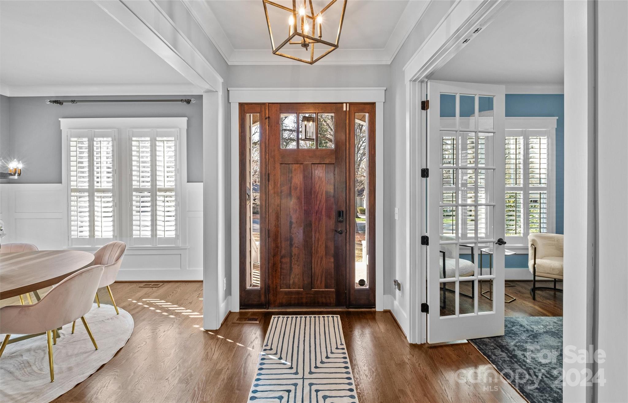 149 McAlway Road Charlotte, NC 28211 - Photo 3 of 48 a view of a bedroom with wooden floor and furniture