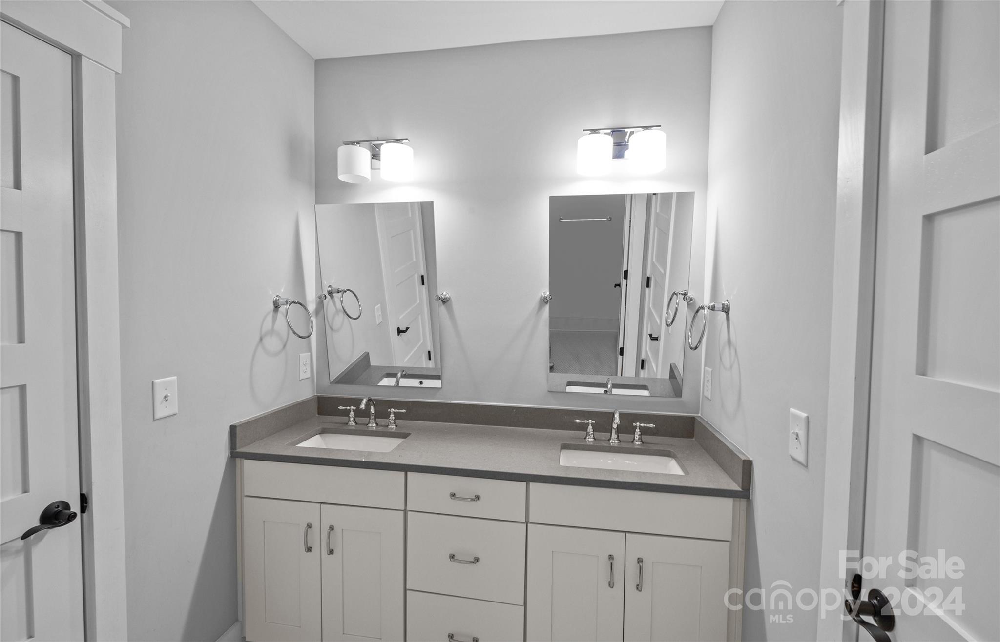 149 McAlway Road Charlotte, NC 28211 - Photo 31 of 48 a bathroom with double sink and a mirror
